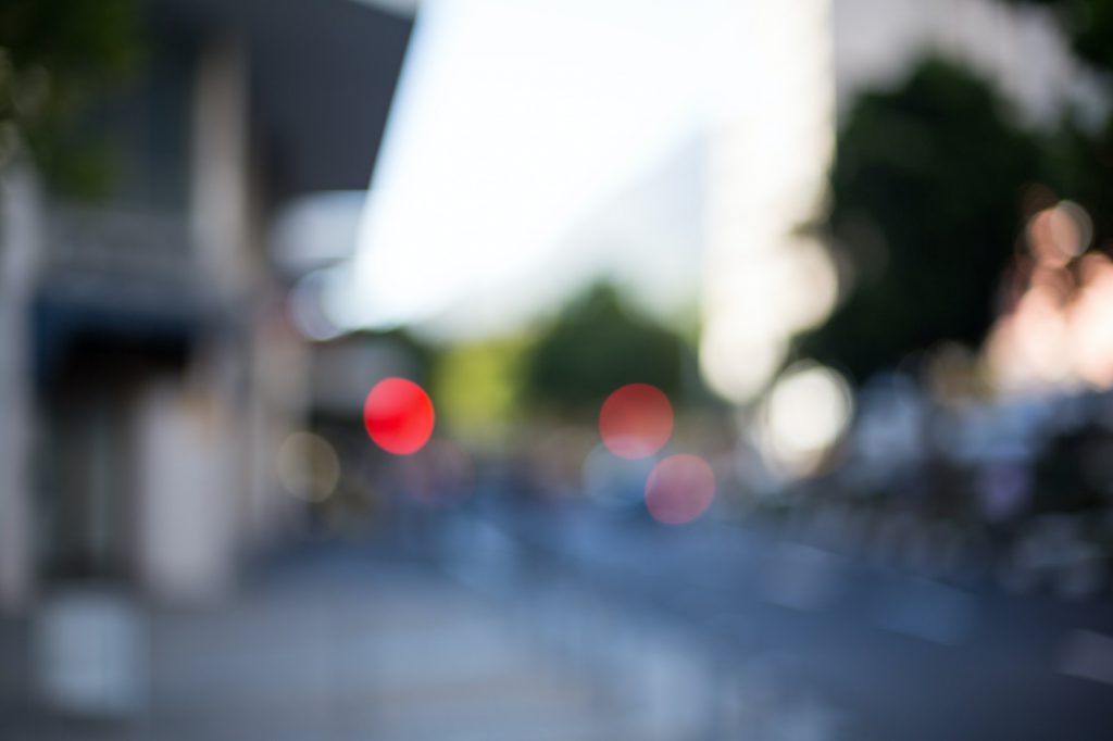 A blurry urban street scene
